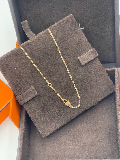 Hermès - Kelly padlock pendant in pink gold and diamonds