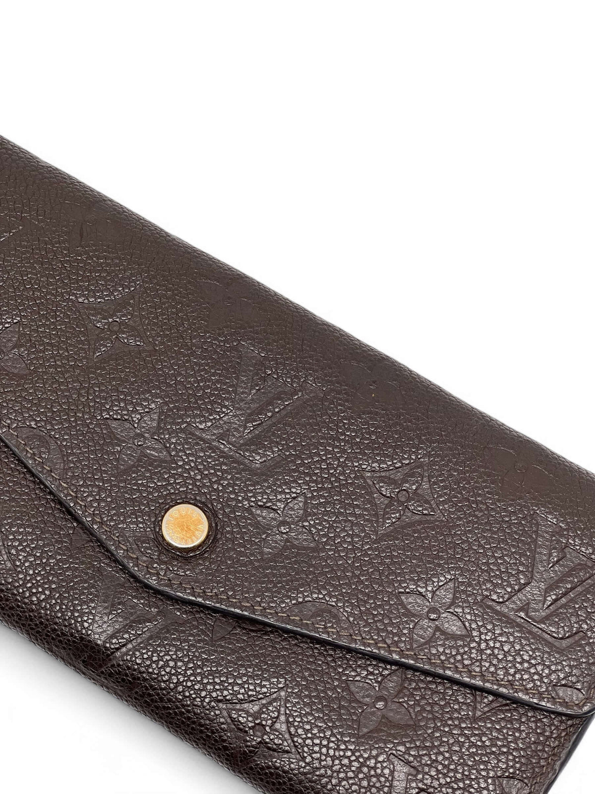 Louis Vuitton - Geldbörse Sarah aus geprägtem Monogramm-Leder