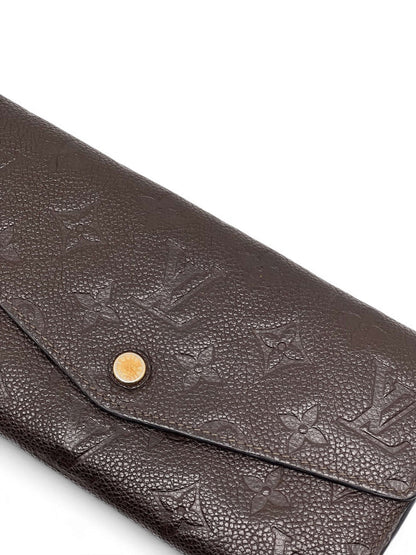 Louis Vuitton - Geldbörse Sarah aus geprägtem Monogramm-Leder