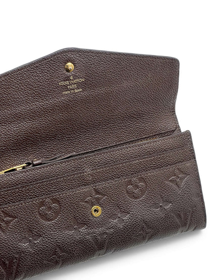 Louis Vuitton - Geldbörse Sarah aus geprägtem Monogramm-Leder