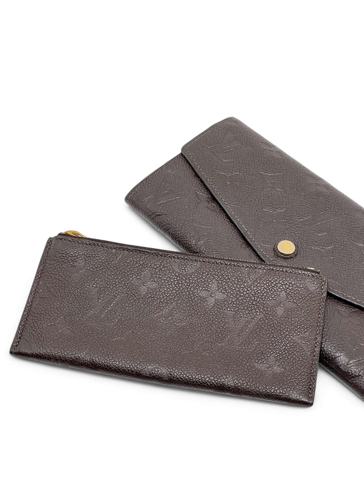 Louis Vuitton - Geldbörse Sarah aus geprägtem Monogramm-Leder