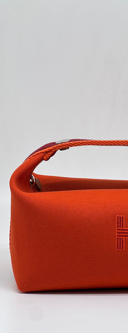 Hermès - Sac Trousse Bride à Brac orange feu