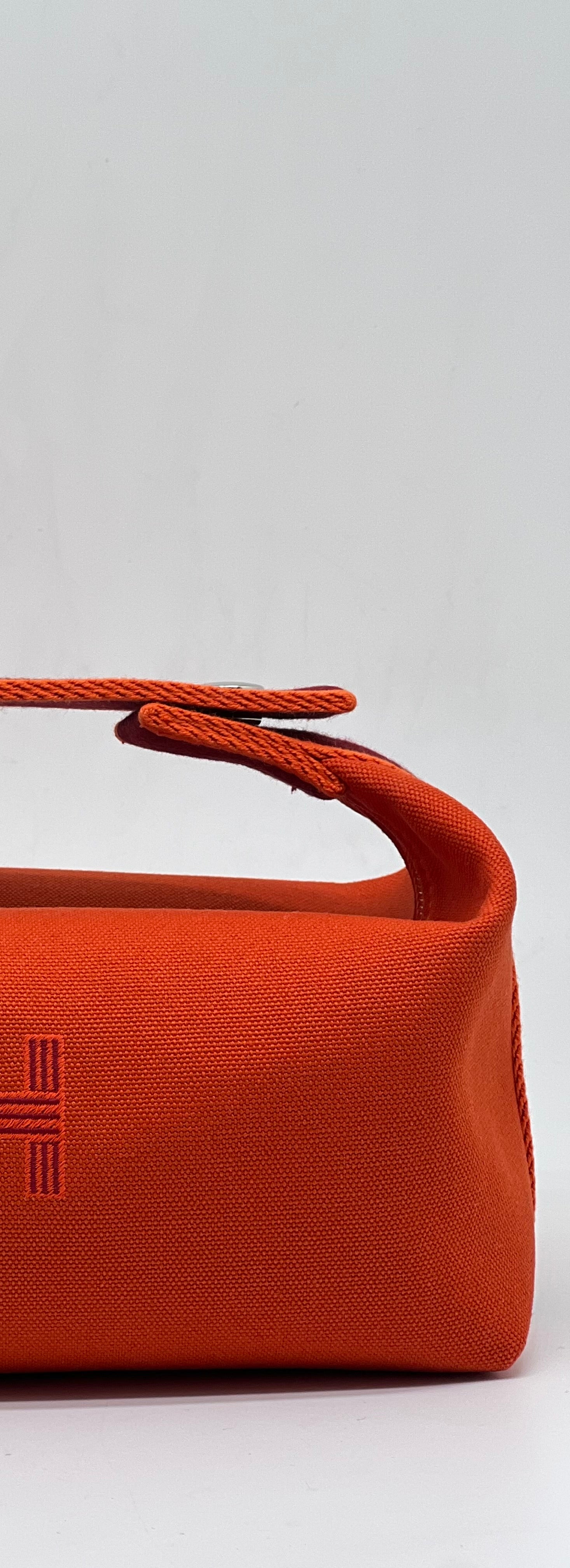 Hermès - Sac Trousse Bride à Brac orange feu