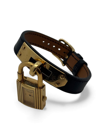 Hermès - Montre Kelly plaqué or et cuir noir