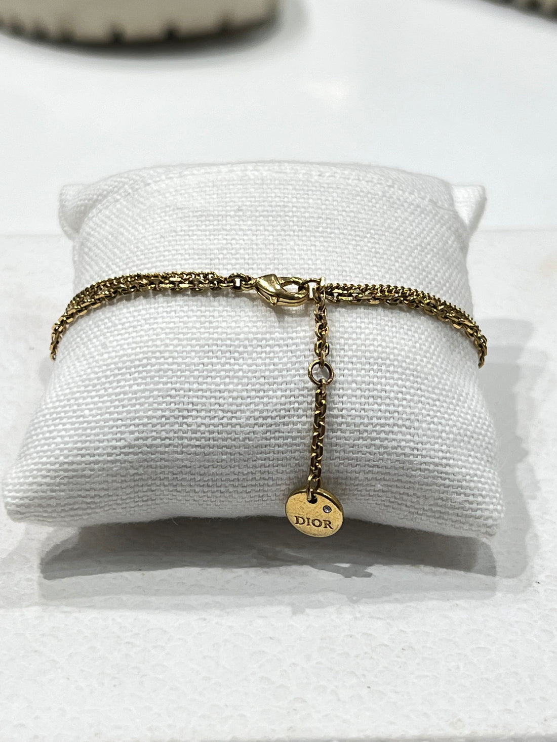 Dior - bracelet chaîne dorée ce et étoile strass