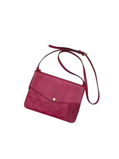 Louis Vuitton - Sac pochette en cuir monogramme rouge