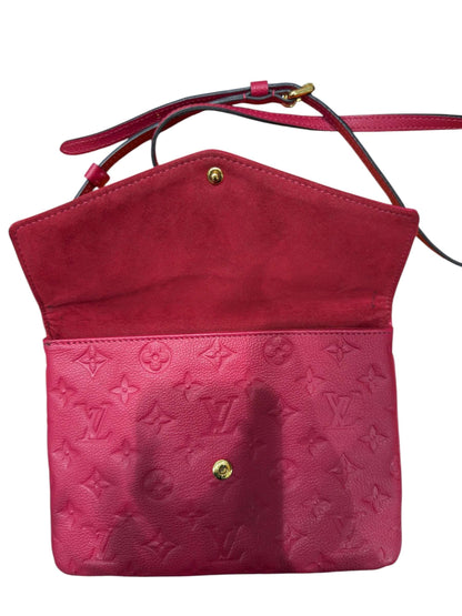 Louis Vuitton - Sac pochette en cuir monogramme rouge
