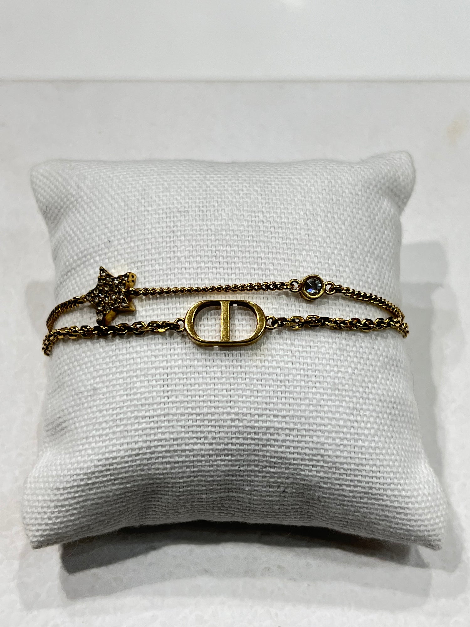 Dior - bracelet chaîne dorée ce et étoile strass