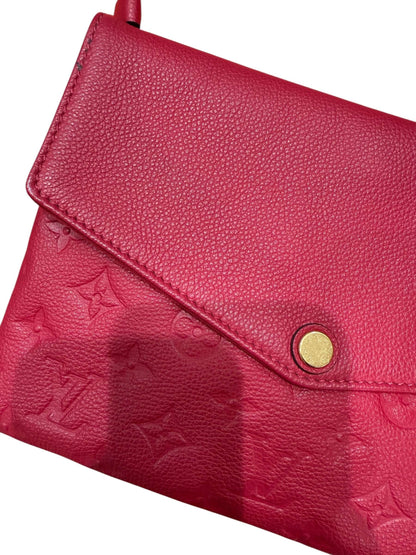 Louis Vuitton - Sac pochette en cuir monogramme rouge