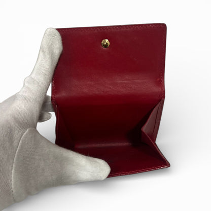 Louis Vuitton - Porte monnaie en cuir vernis rouge